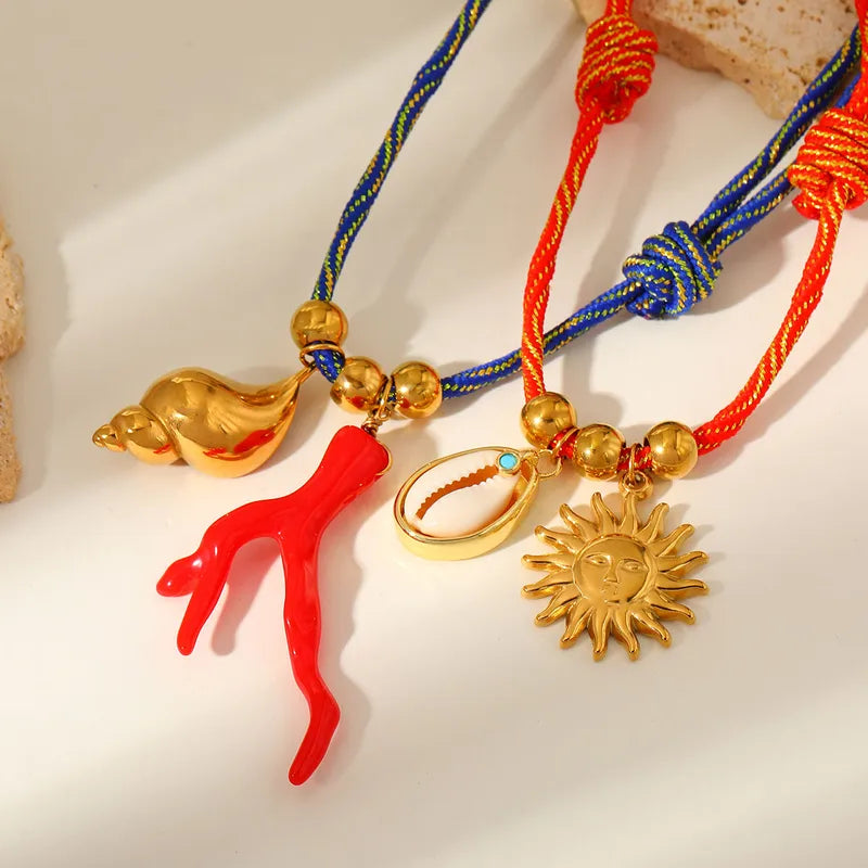 Collar Cordón Azul Dijes Coral y Caracol