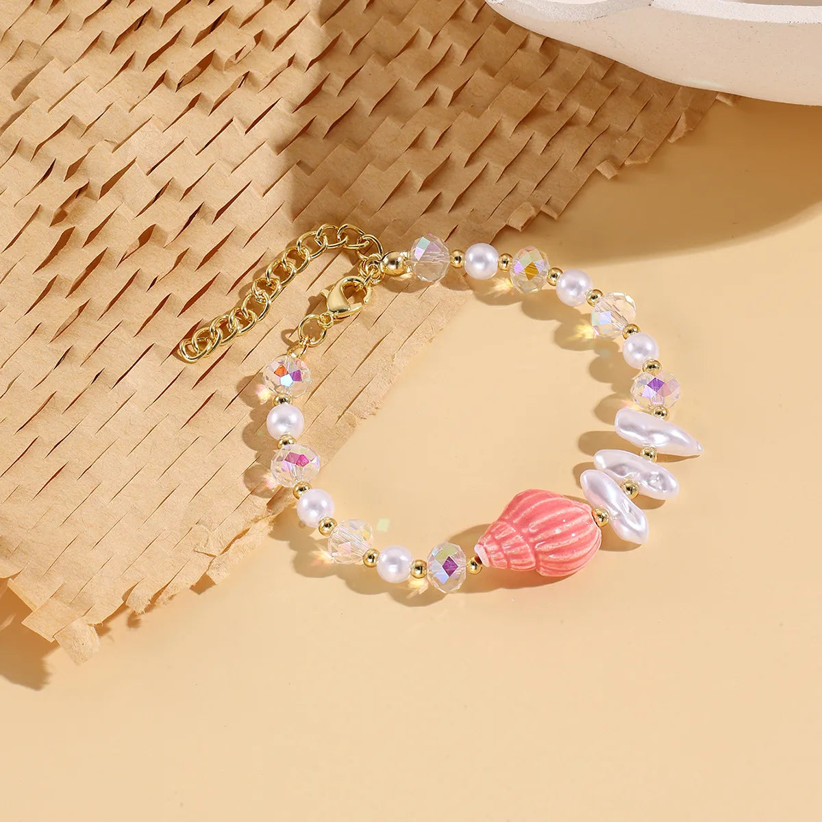 Pulsera de perlas y Caracol Rosa