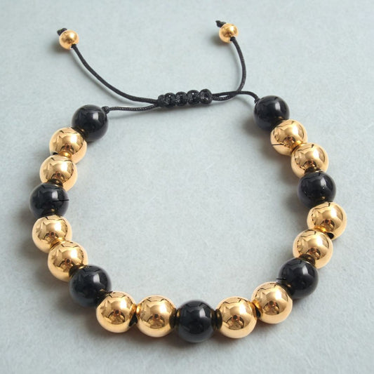Pulsera de Hilo con Cuencas Doradas y Negras Acero de 10mm