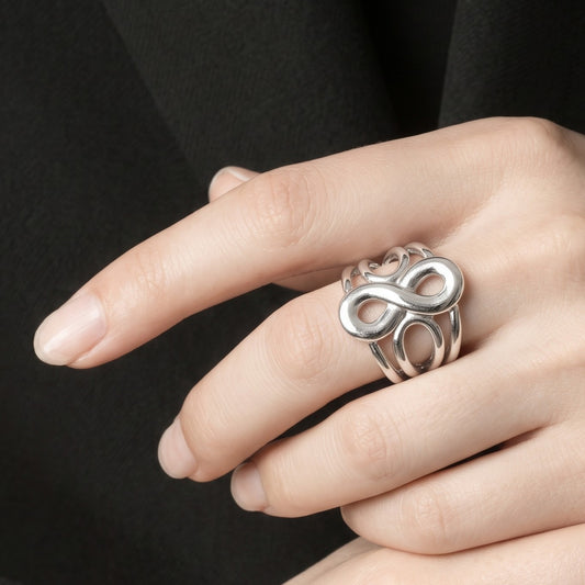 Anillo Plateado Infinito Calado - Ajustable