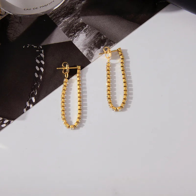 Aretes Largos Dorados y Circón