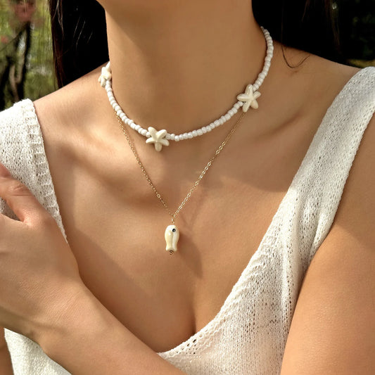 Collar Doble Cuencas Blancas y Cadena Dijes Marinos