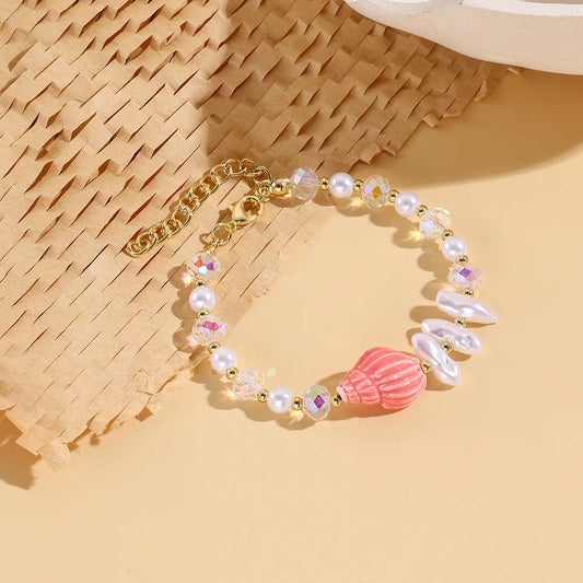 Pulsera de perlas y Caracol Rosa