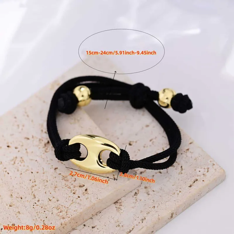 Pulsera Cordón Negro y Trompa Cochino Dorado